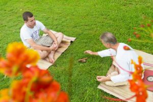 Two males having a mindfulness session as part of addiction treatment in Thailand