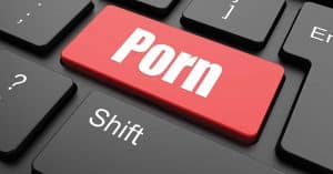Close up of a red “porn” button on a computer keyboard