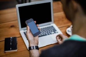 A social media addict constantly checks their phone