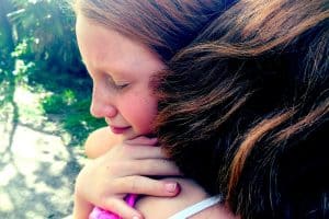 a girl is hanging her friend because she is feeling depressed with her life and direction.