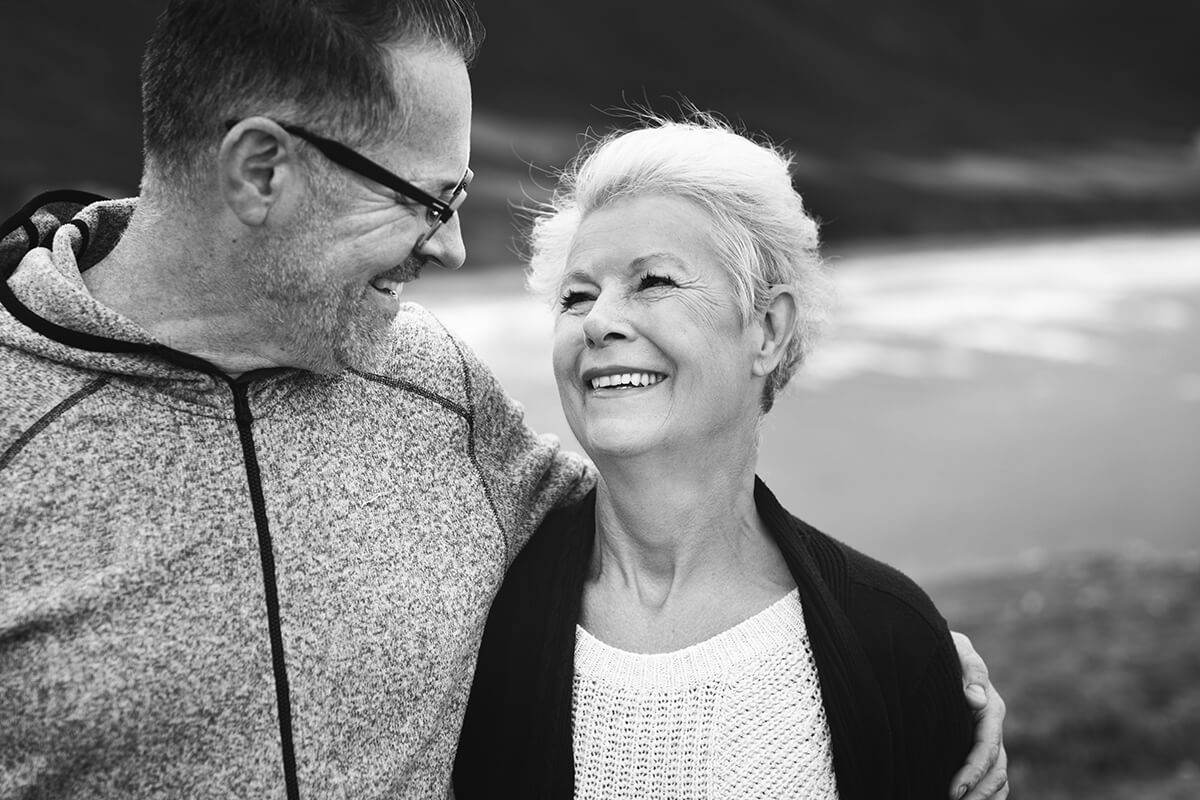 a retired couple hugging and encouraging one another 1 - Have the Golden Years Lost their Luster? Depression Could be to Blame