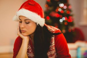 Woman facing loneliness during her Christmas time.