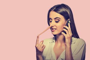 Woman lying on the phone to her friend