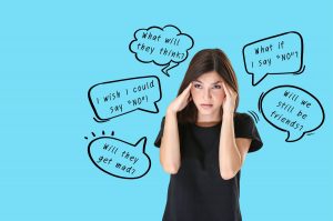 a woman is struggling with her pleasing behaviour