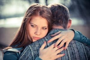 A woman is struggling with a toxic relationship with her boyfriend but cannot deny to leave.